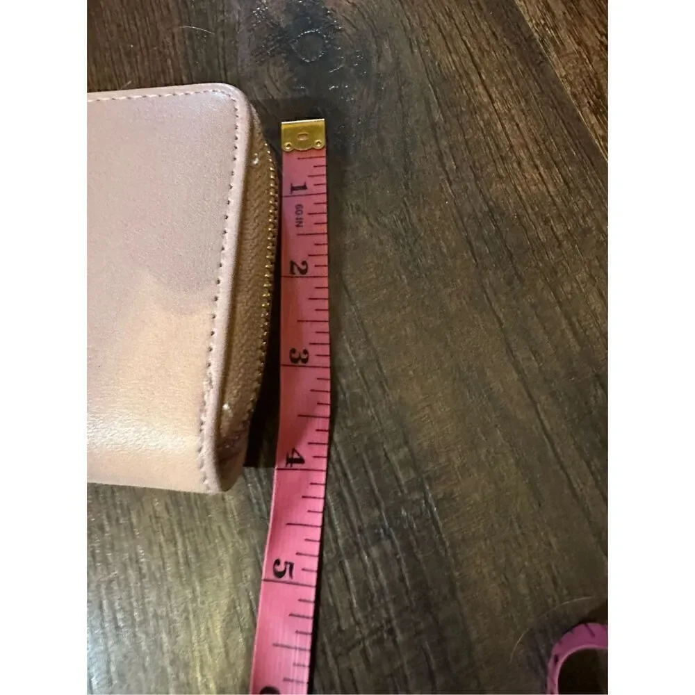 BEBE Pink and gold, large wristlet. Lots of room never used.